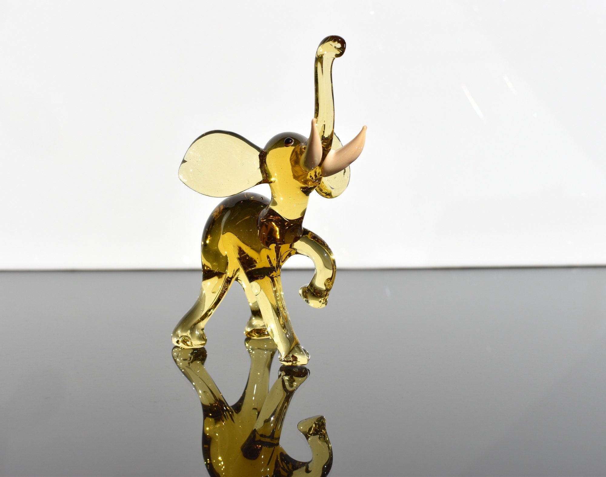 Amber Glass Elephant Figurine: Whimsical Handmade Sculpture