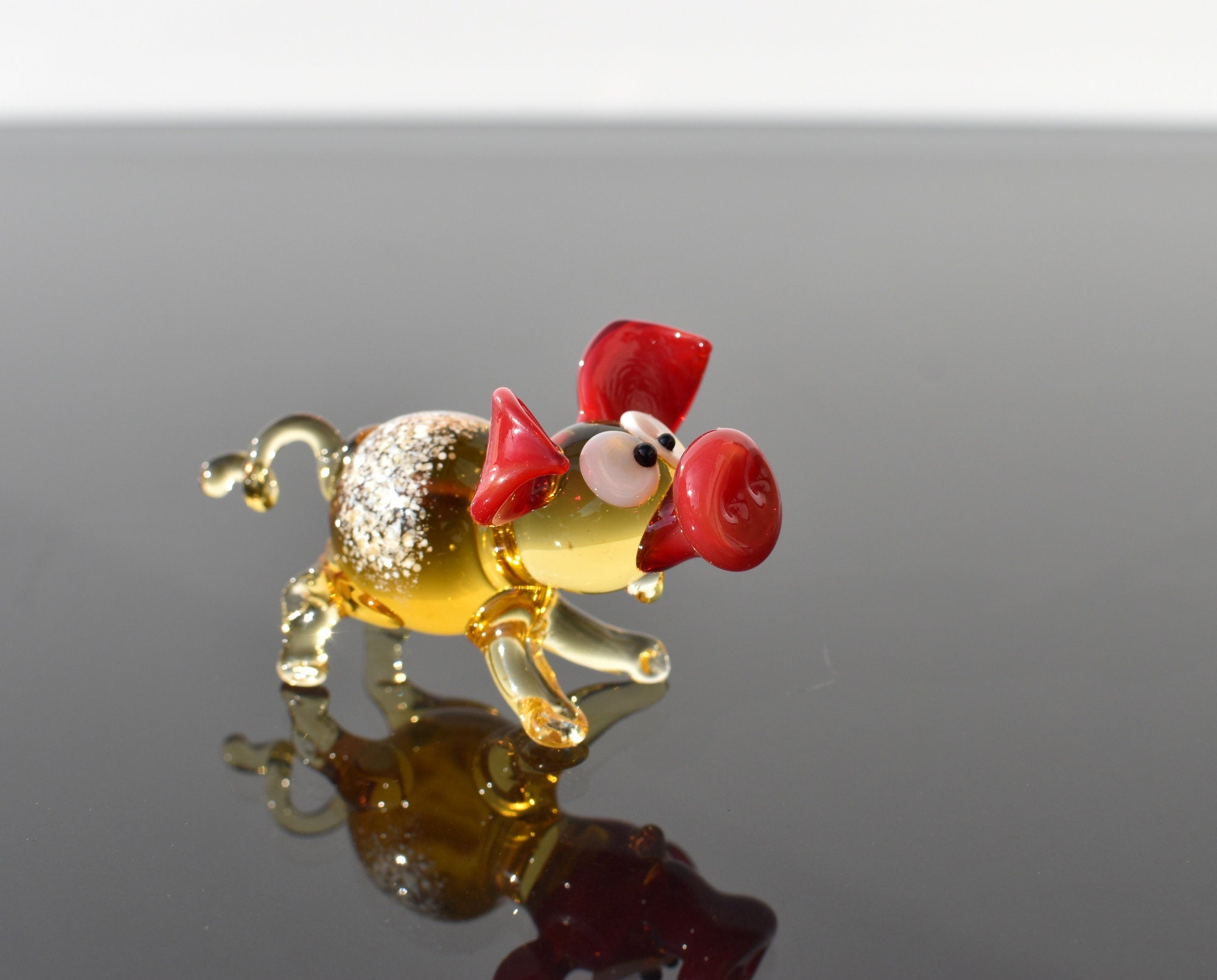 Cute glass pig. Whimsical figurine; lot of character and personality. Excellent addition to your glass collection, unique gift.
