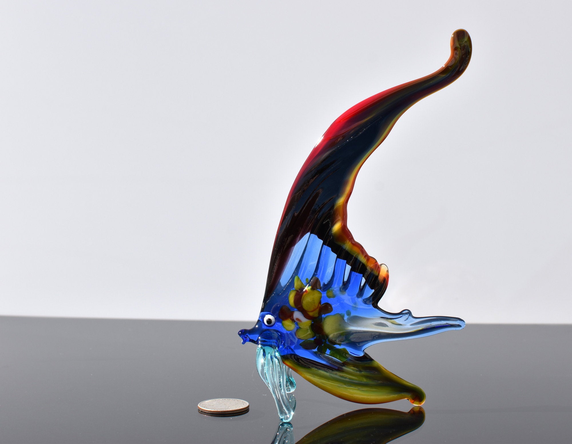 Gorgeous multicolor Glass Fish. Whimsical figurine with a lot of character and personality. Excellent addition to you glass collection