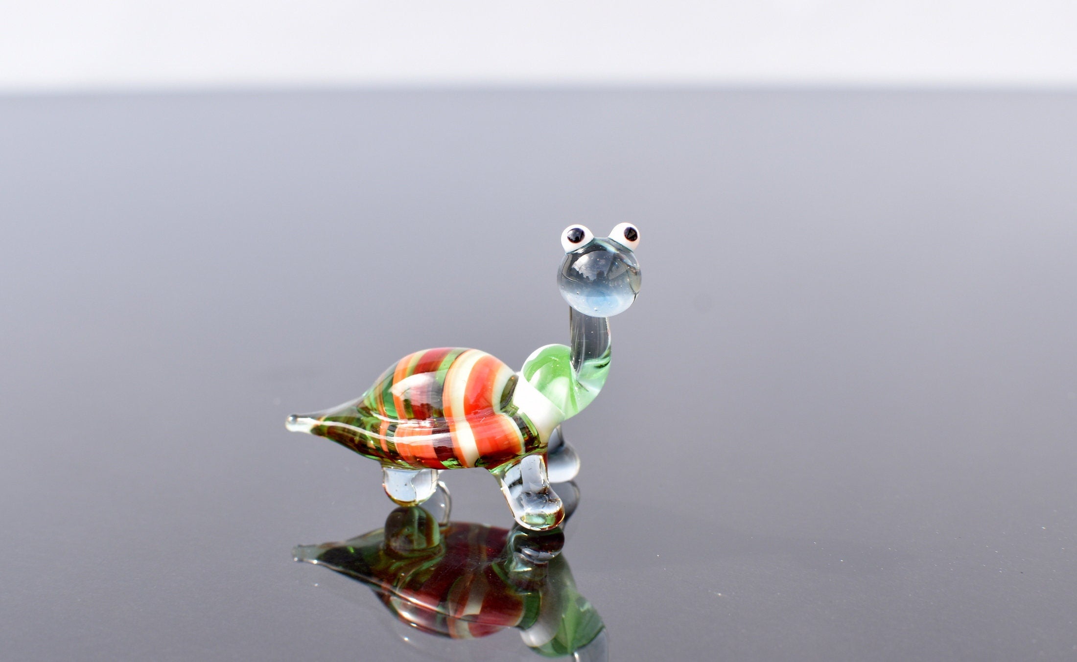 Cute glass turtle. Whimsical figurine; lot of character and personality. Excellent addition to your glass collection, unique gift.