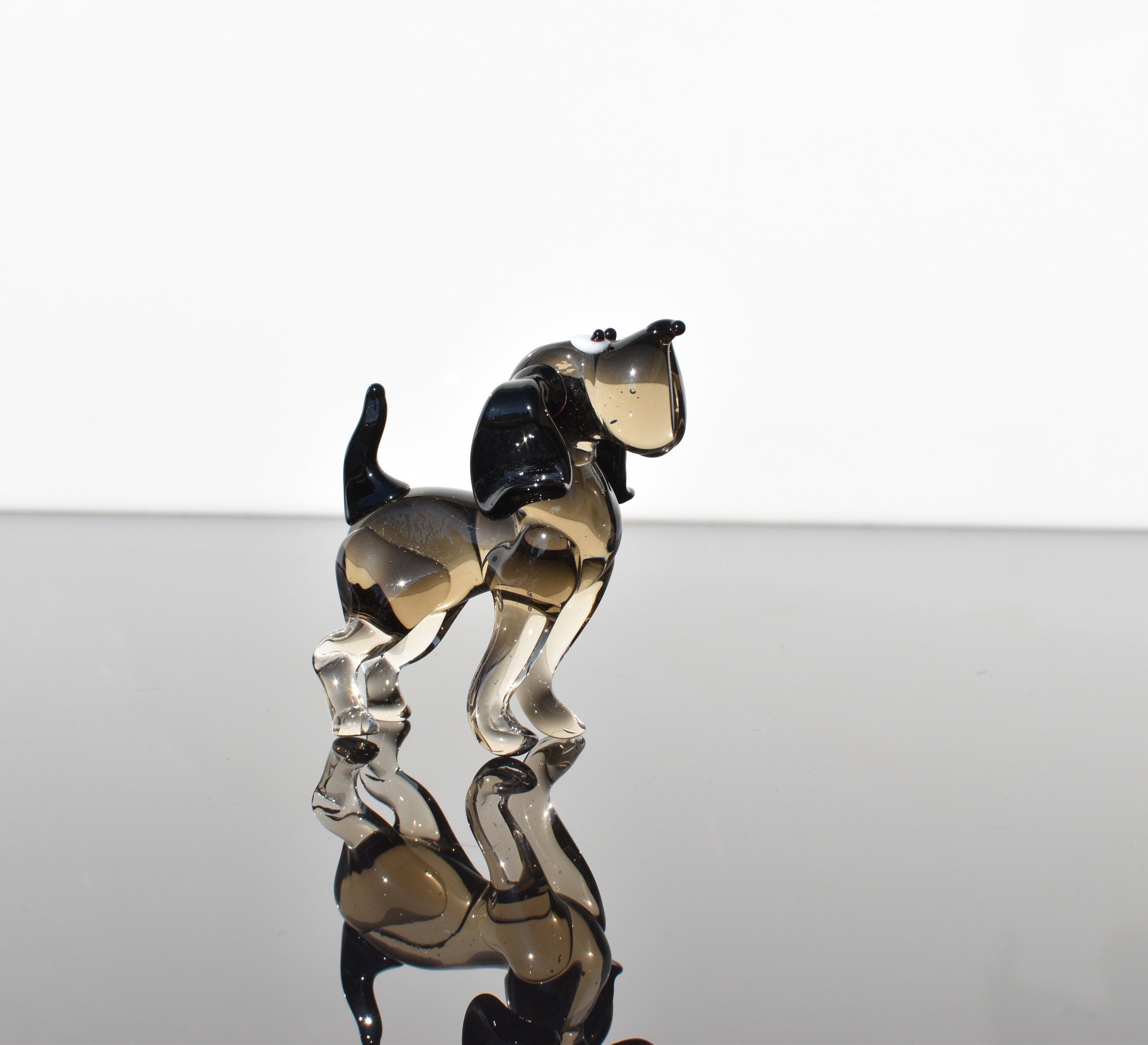 Cute glass dog. Whimsical figurine; lot of character and personality. Excellent addition to your glass collection, unique gift.