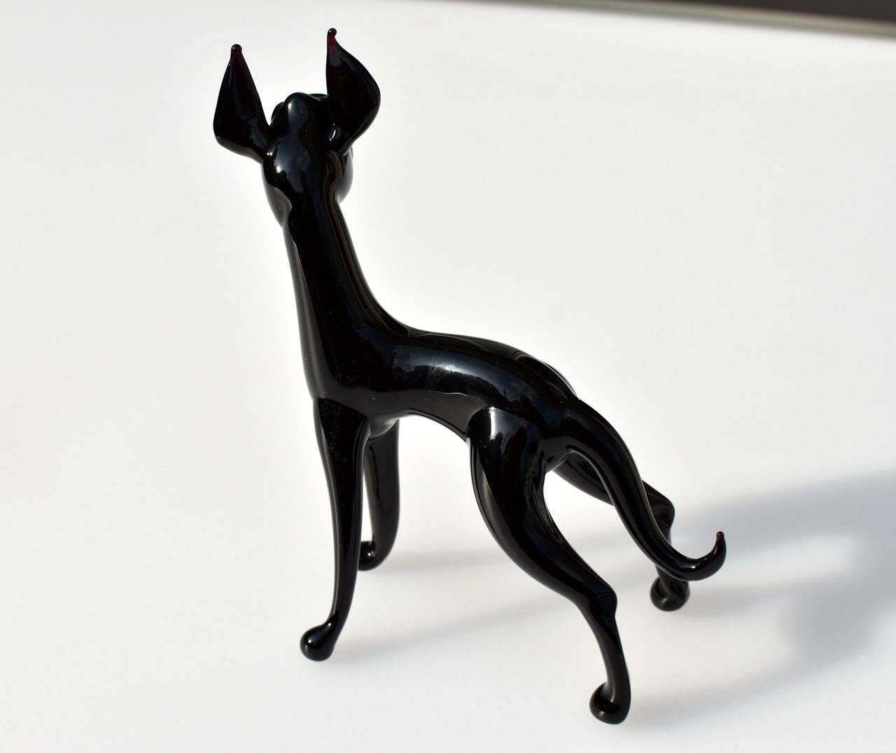 Black Glass Great Dane. Detailed figurine with a lot of character and personality.  Excellent addition to your glass menagerie collection.