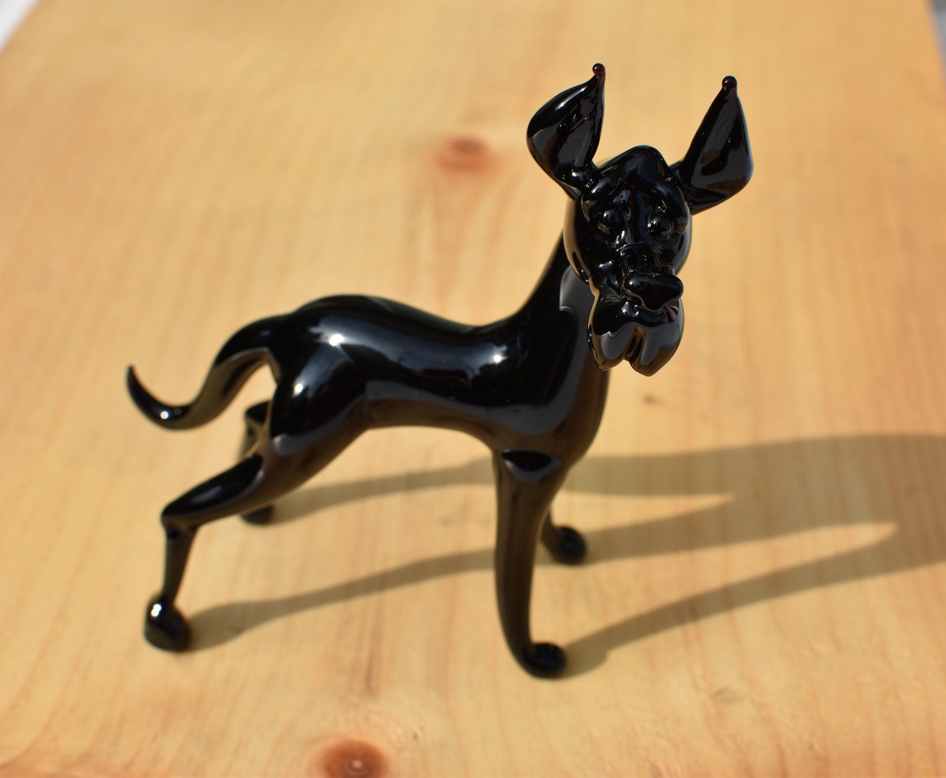 Black Glass Great Dane. Detailed figurine with a lot of character and personality.  Excellent addition to your glass menagerie collection.