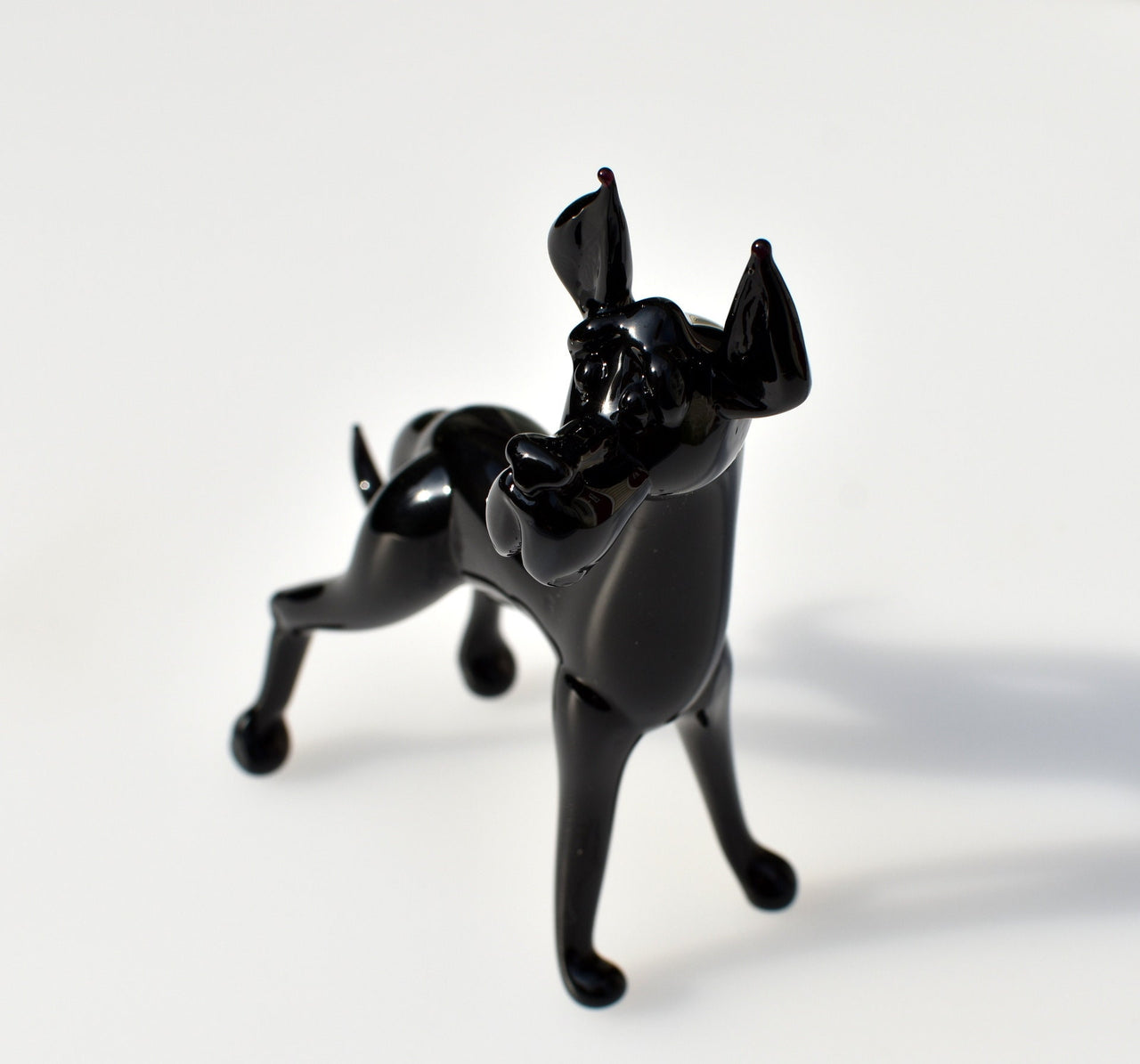 Black Glass Great Dane. Detailed figurine with a lot of character and personality.  Excellent addition to your glass menagerie collection.