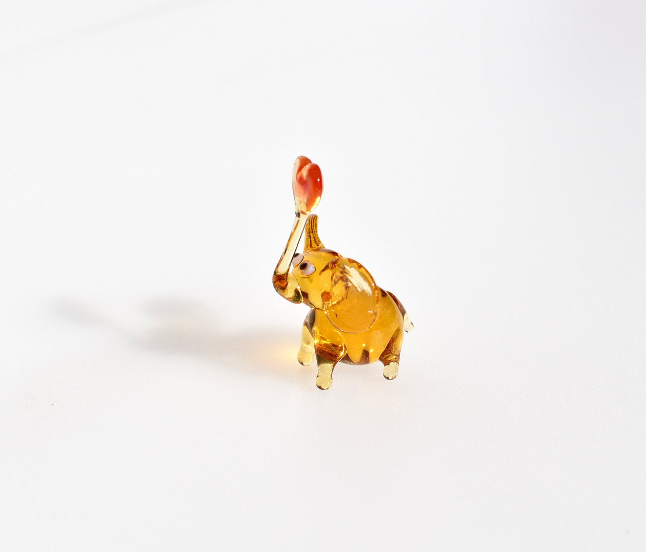 Tiny Glass Elephant Miniature: Whimsical Heart Figurine