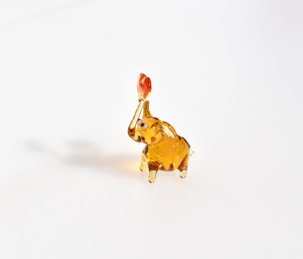 Tiny Glass Elephant Miniature: Whimsical Heart Figurine