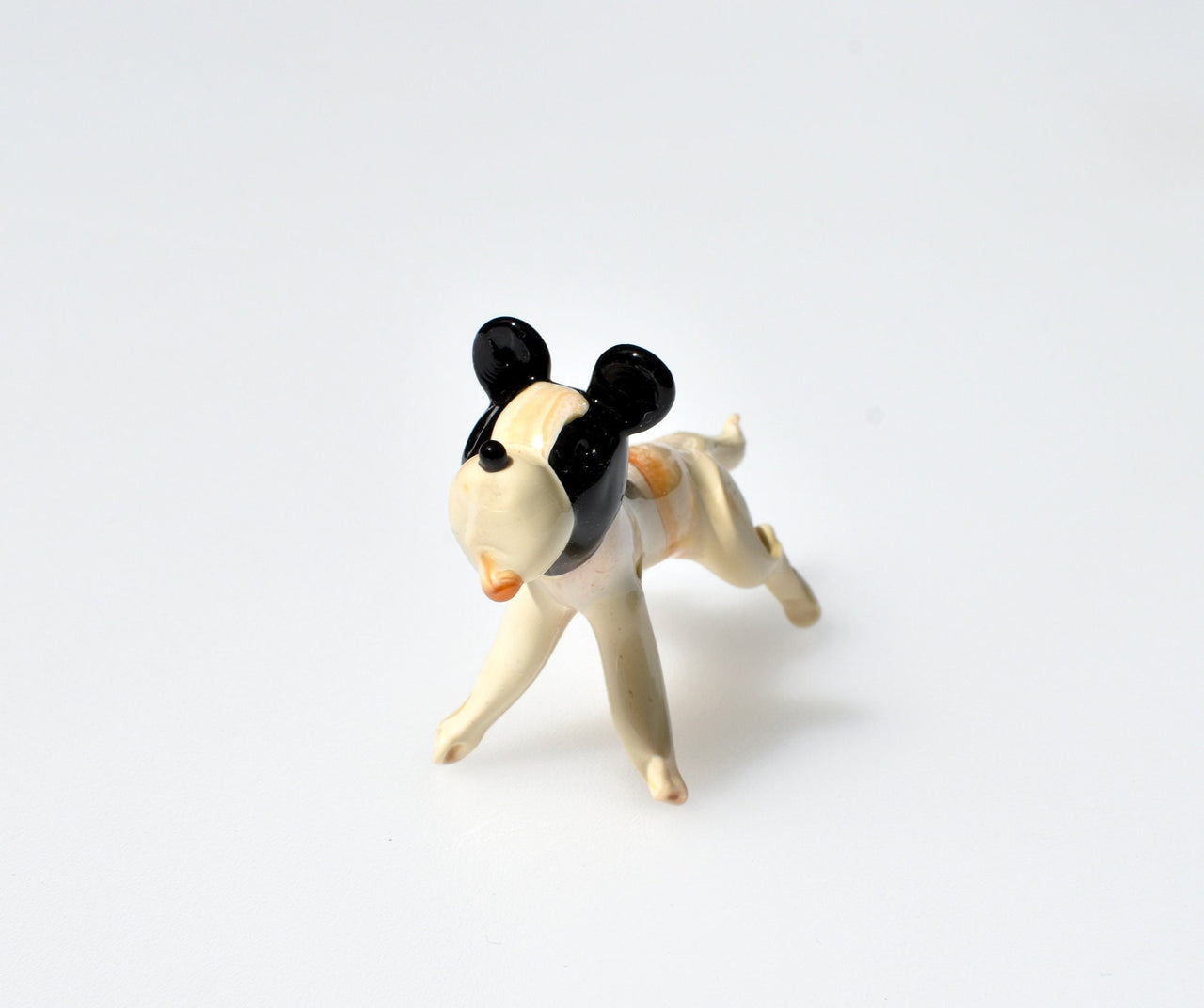 Cute Glass dog. Whimsical figurine, lots of  character and personality. Excellent addition to your glass menagerie collection.