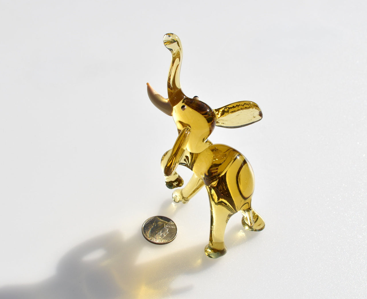 Amber Glass Elephant Figurine: Whimsical Handmade Sculpture