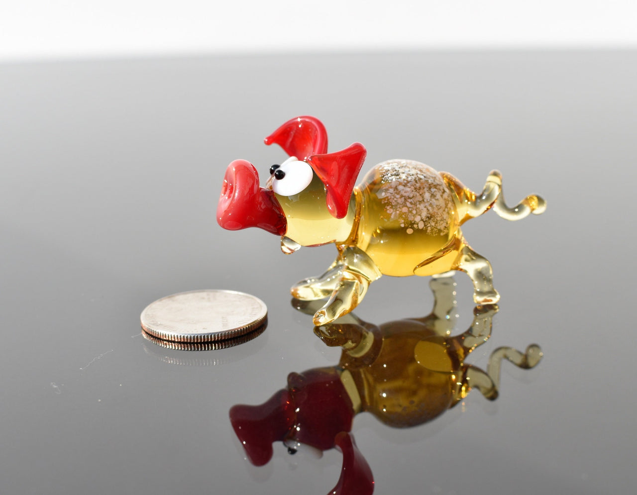 Cute glass pig. Whimsical figurine; lot of character and personality. Excellent addition to your glass collection, unique gift.