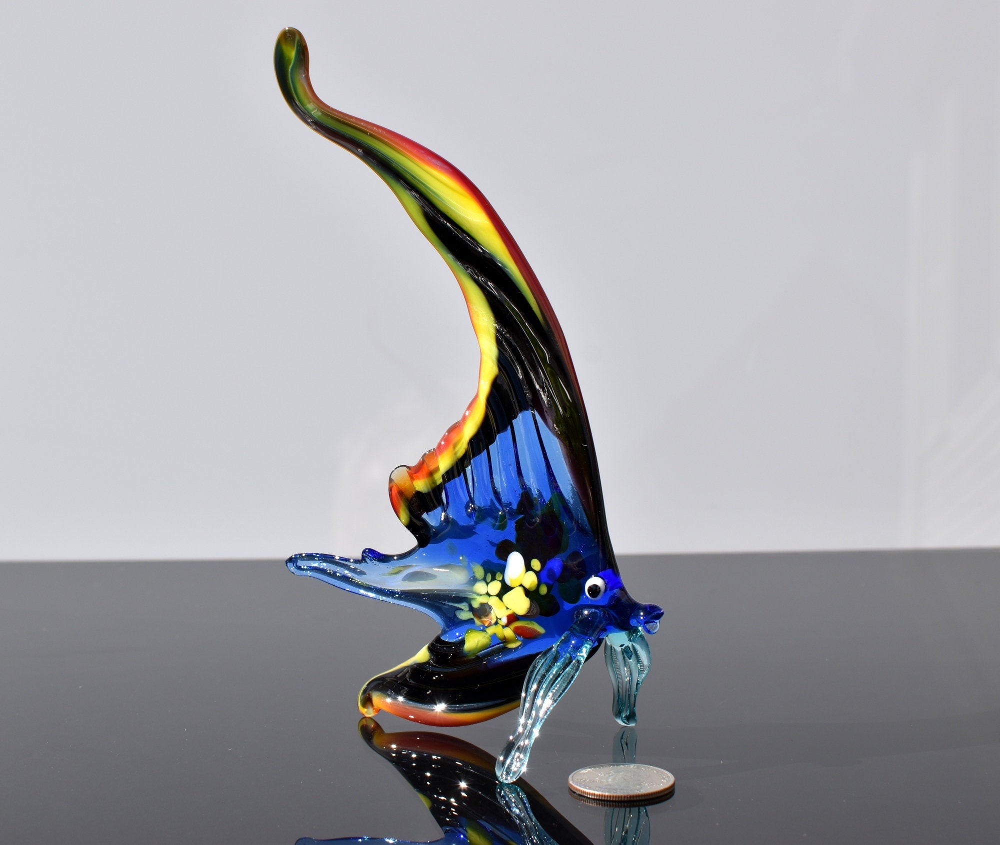 Gorgeous multicolor  Glass Fish. Whimsical figurine with a lot of character and personality. Excellent addition to you glass collection