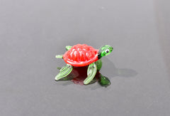 Red Glass Sea Turtle. Detailed figurine with a lot of character and personality.  Excellent addition to you glass menagerie collection