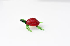Red Glass Sea Turtle. Detailed figurine with a lot of character and personality.  Excellent addition to you glass menagerie collection
