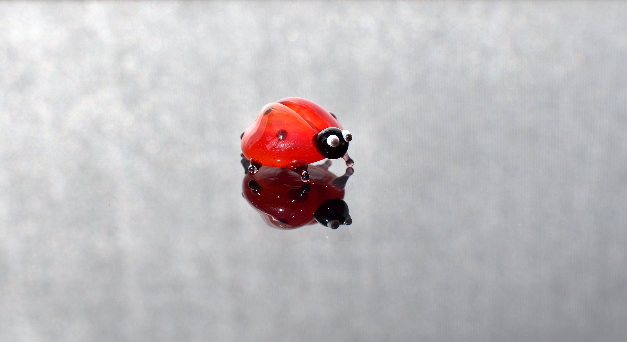 Hand-Blown Glass Ladybug Figurine: Red Insect Sculpture, Nature Lover Gift.