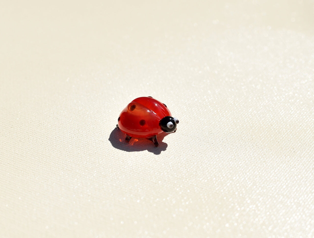 Hand-Blown Glass Ladybug Figurine: Red Insect Sculpture, Nature Lover Gift.