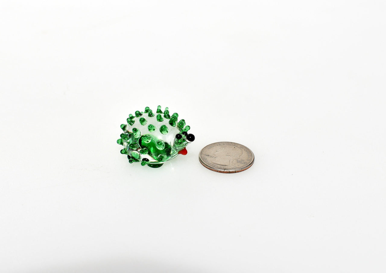 Green clear  color glass cute  hedgehog. Whimsical figurine with a lot of  personality. Excellent addition to your glass collection.