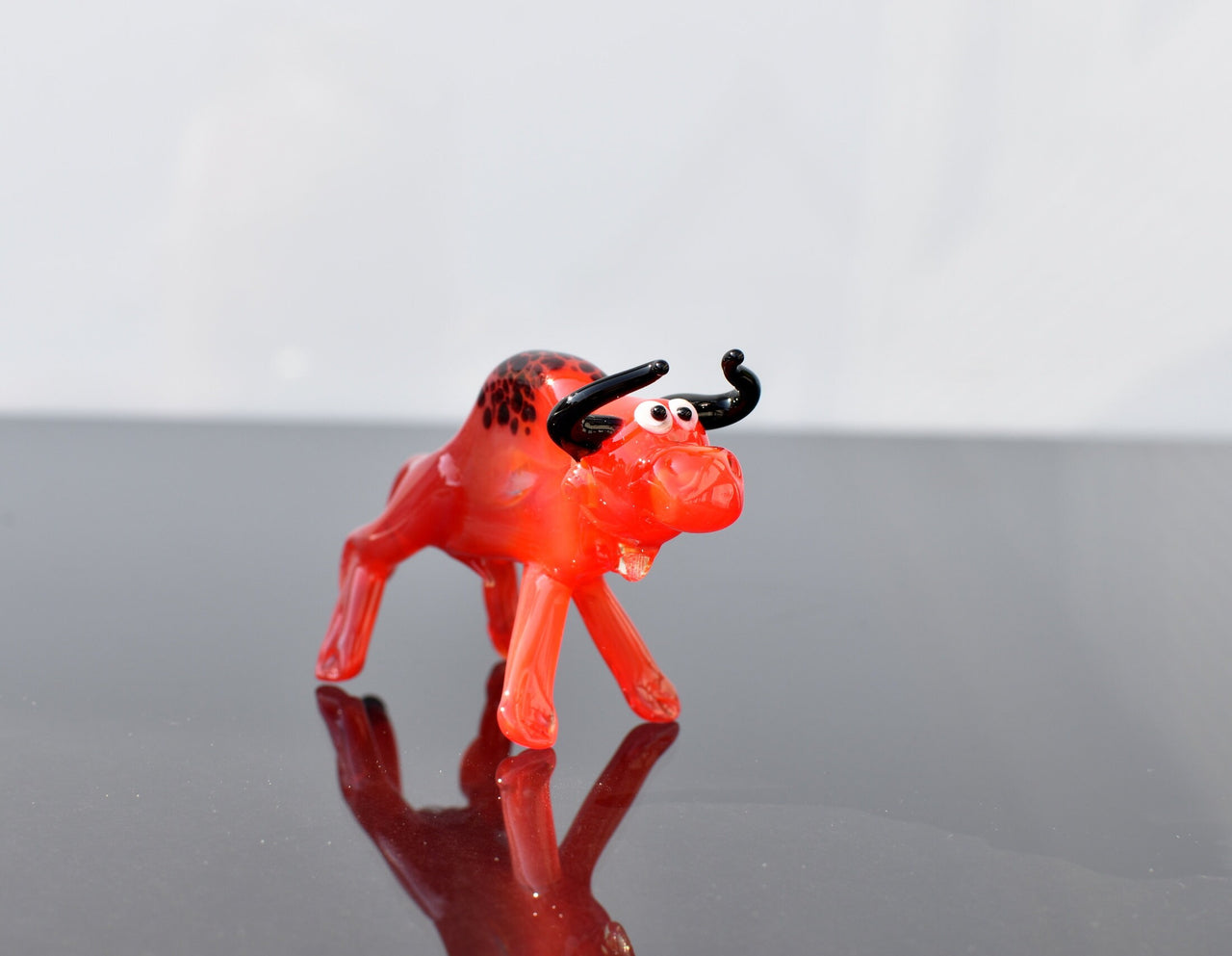 Handmade Red Glass Bull Figurine: Whimsical Flamework Animal