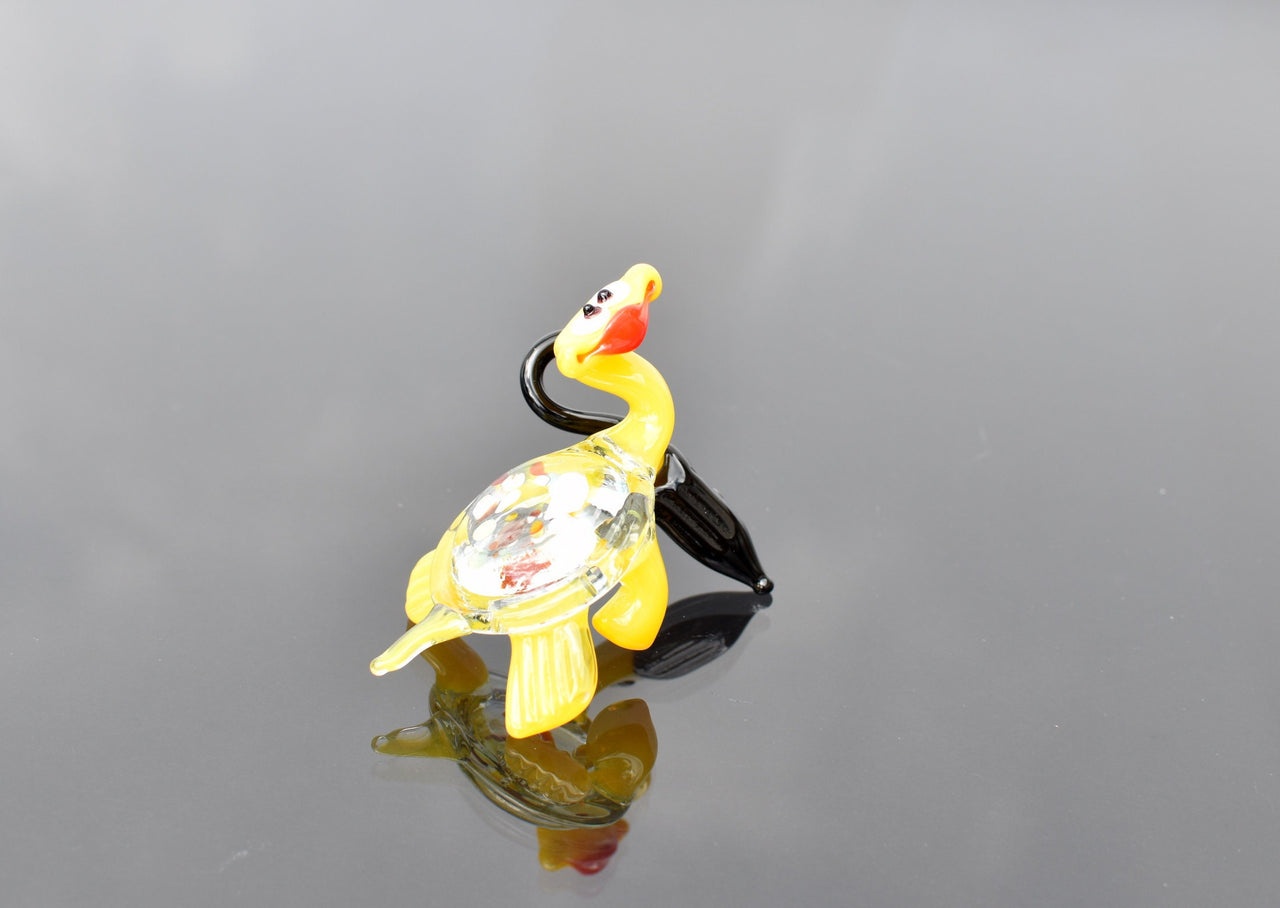 Cute yellowish-clear Glass Turtle with ambarella . Whimsical figurine with character and personality. Excellent addition to your collection.