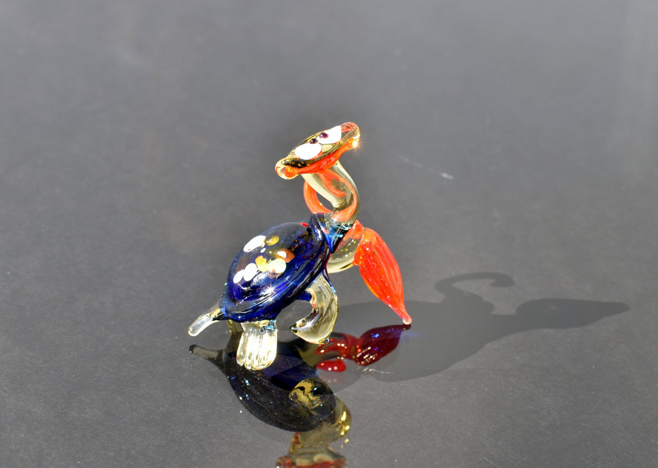 Cute blue-red Glass Turtle with ambarella . Whimsical figurine with character and personality. Excellent addition to your collection.