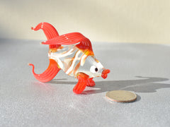 Cute Glass red-clear colorful goldfish. Detailed figurine with a lot of character and personality.  Excellent addition to your collection.