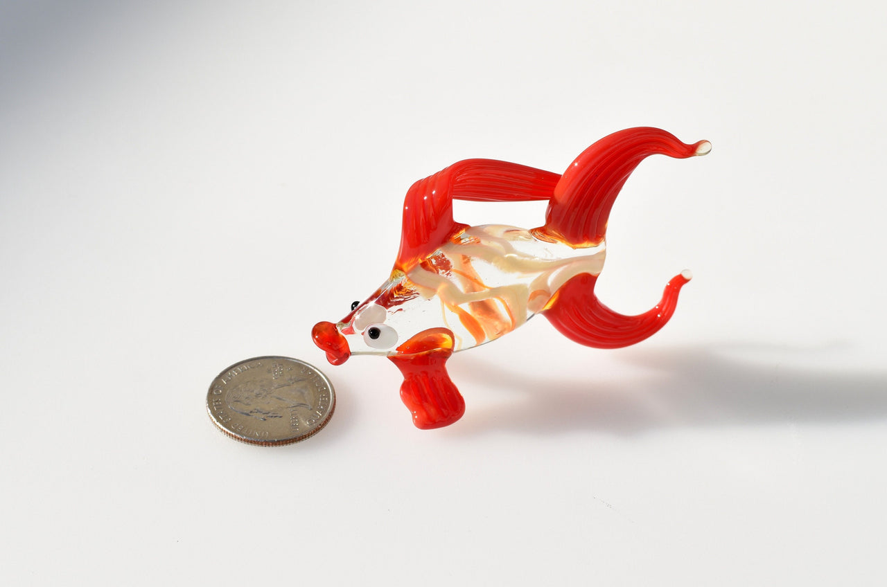 Cute Glass red-clear colorful goldfish. Detailed figurine with a lot of character and personality.  Excellent addition to your collection.