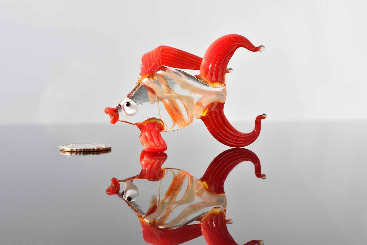 Cute Glass red-clear colorful goldfish. Detailed figurine with a lot of character and personality.  Excellent addition to your collection.