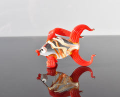 Cute Glass red-clear colorful goldfish. Detailed figurine with a lot of character and personality.  Excellent addition to your collection.