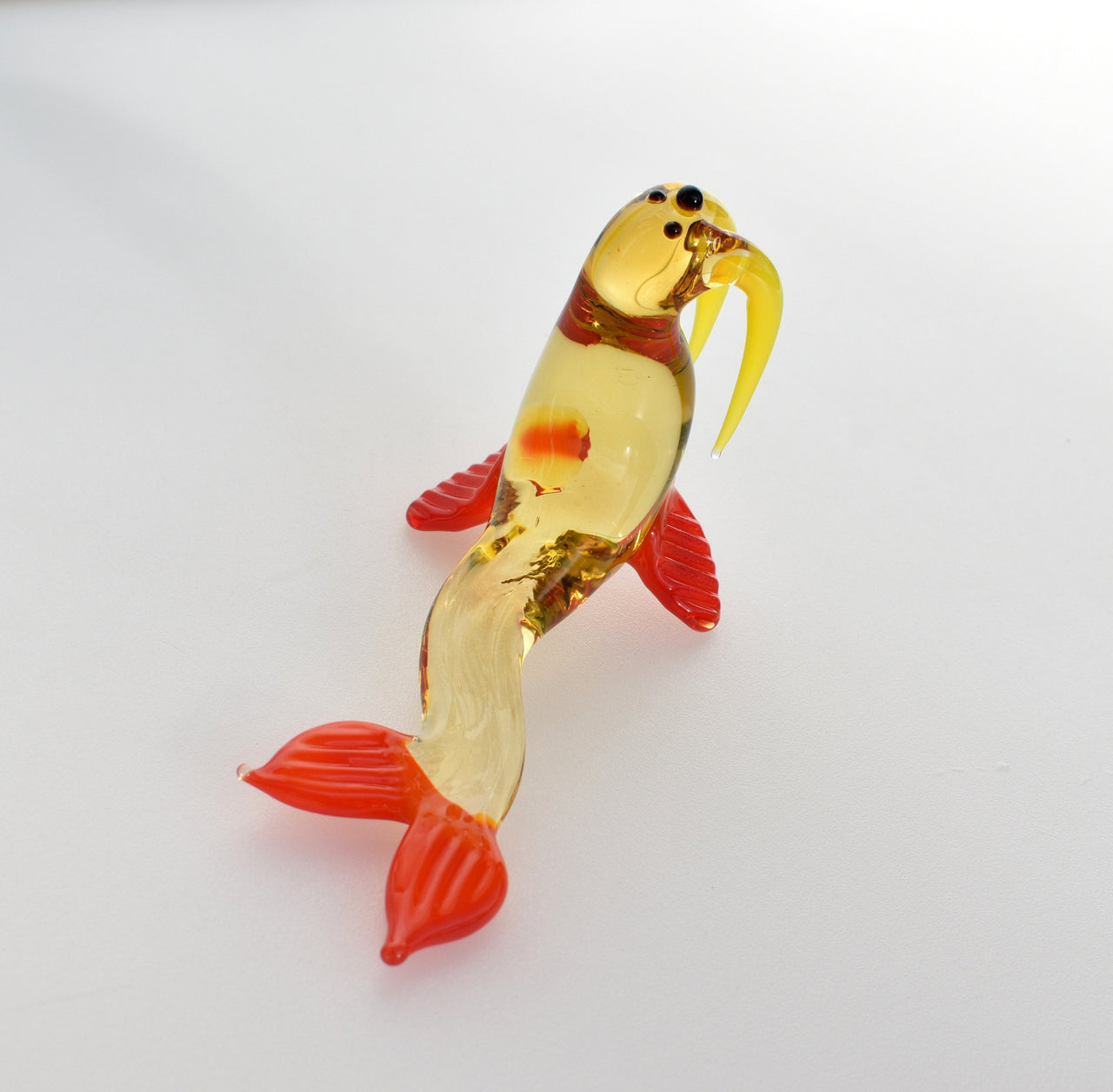 Cute transparent Glass Walrus. Whimsical figurine with a lot of character and personality. Excellent addition to your collection.