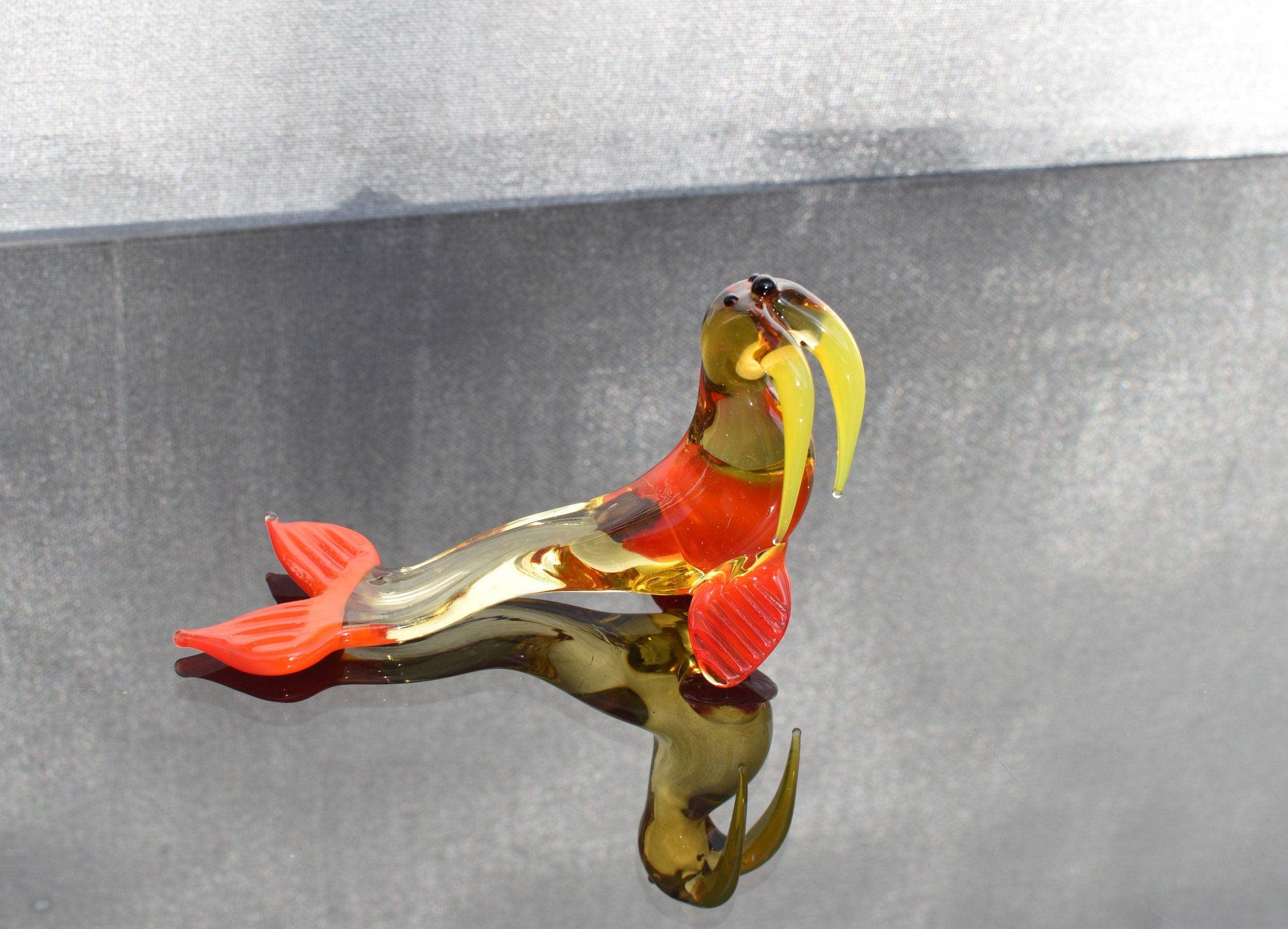 Cute transparent Glass Walrus. Whimsical figurine with a lot of character and personality. Excellent addition to your collection.