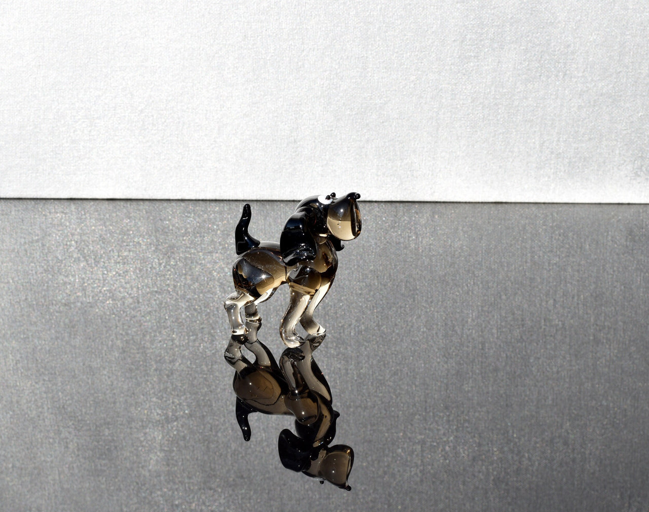 Cute  glass dog. Whimsical figurine; lot of character and personality. Excellent addition to your glass collection, unique gift.