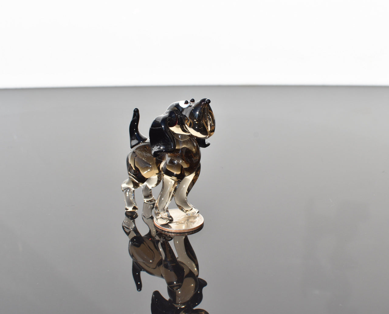 Cute  glass dog. Whimsical figurine; lot of character and personality. Excellent addition to your glass collection, unique gift.