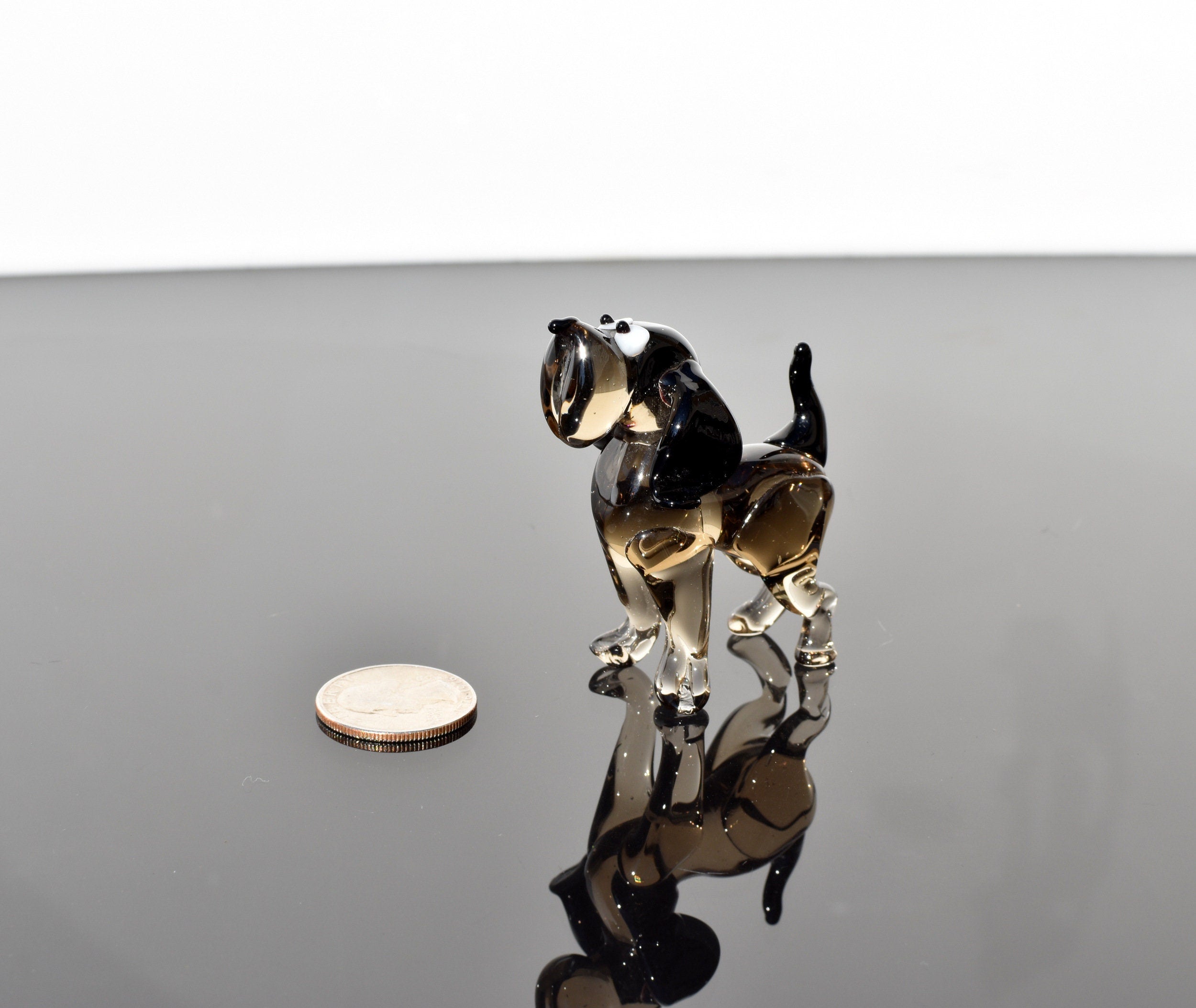 Cute  glass dog. Whimsical figurine; lot of character and personality. Excellent addition to your glass collection, unique gift.