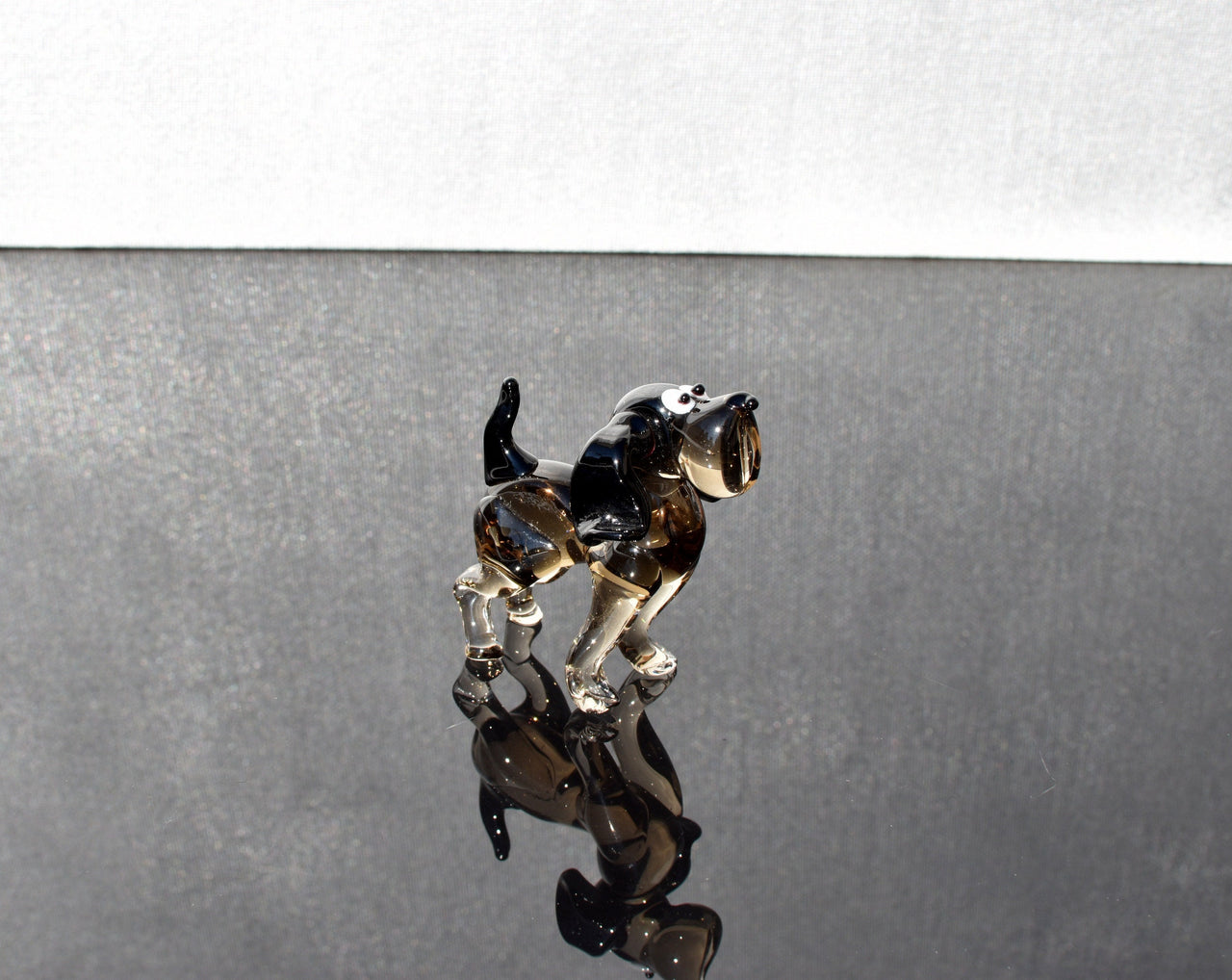 Cute  glass dog. Whimsical figurine; lot of character and personality. Excellent addition to your glass collection, unique gift.