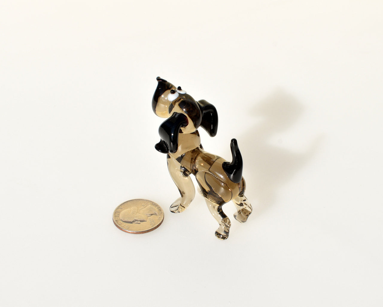Cute  glass dog. Whimsical figurine; lot of character and personality. Excellent addition to your glass collection, unique gift.