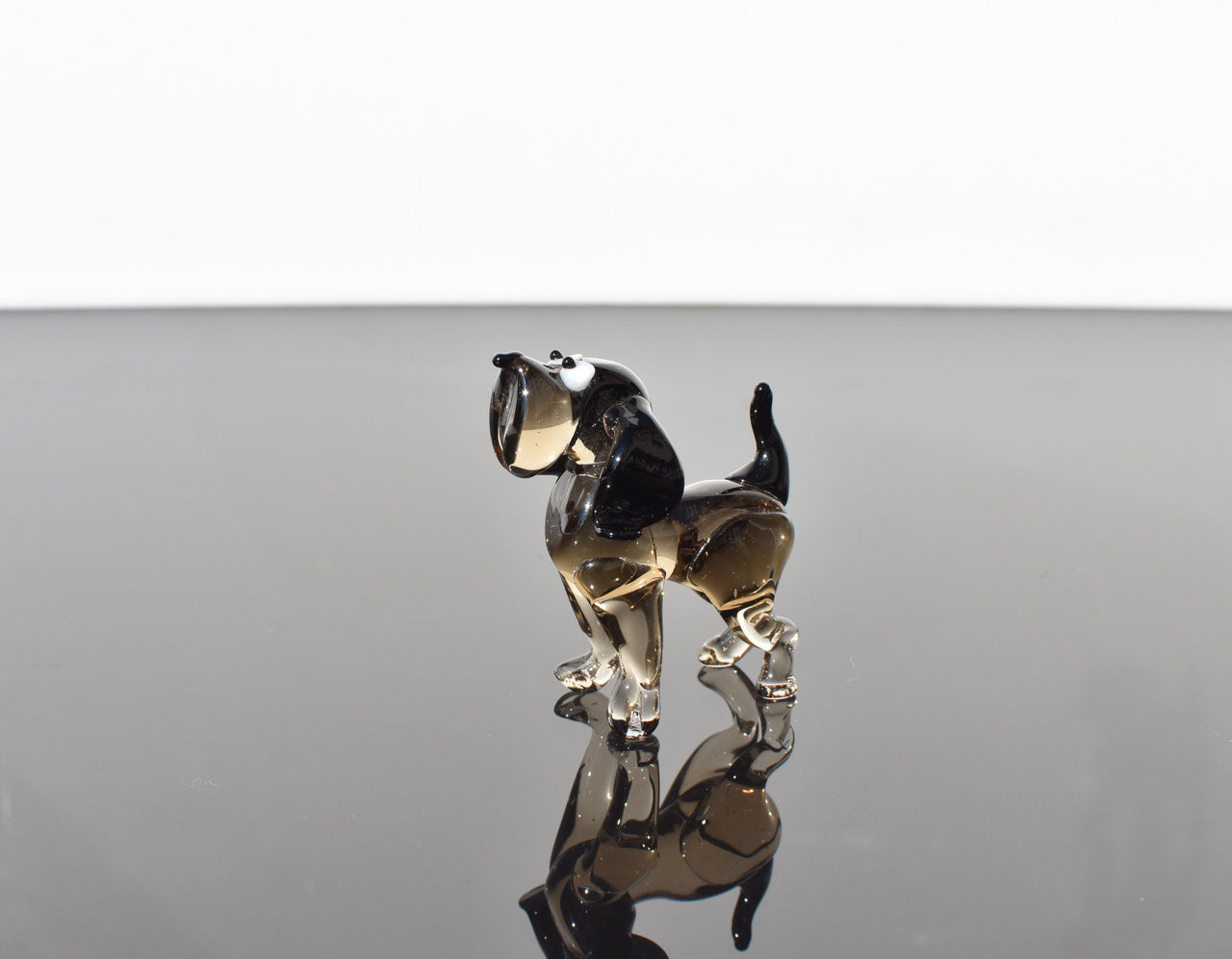 Cute  glass dog. Whimsical figurine; lot of character and personality. Excellent addition to your glass collection, unique gift.