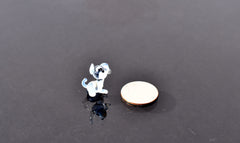 Cute Tiny light blue glass dog. Whimsical figurine with a lot of character and personality. Excellent addition to your collection.