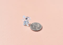 Cute Tiny light blue glass dog. Whimsical figurine with a lot of character and personality. Excellent addition to your collection.