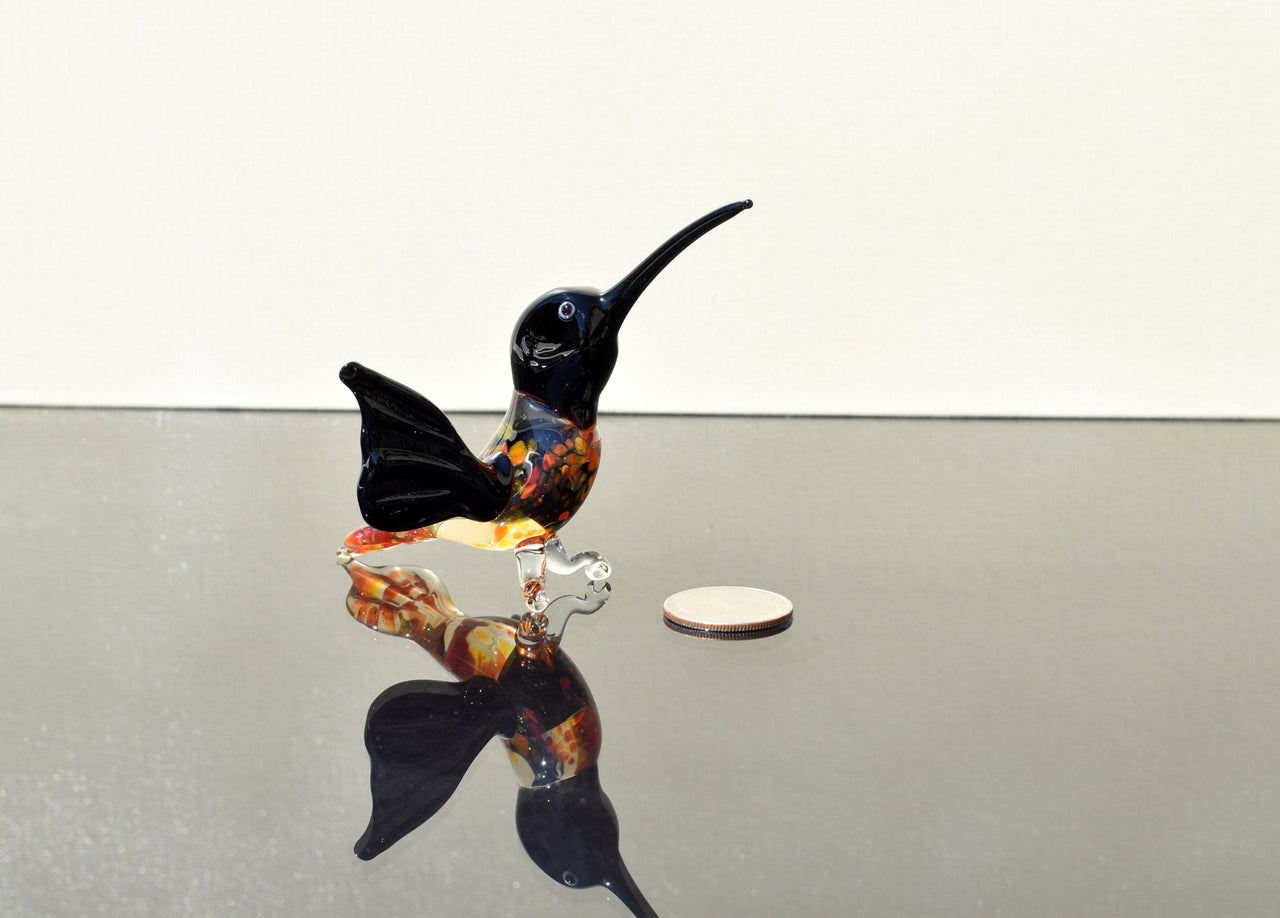 Beautiful colored Glass clear black hummingbird. Detailed figurine with character and personality.  Excellent addition to your collection.