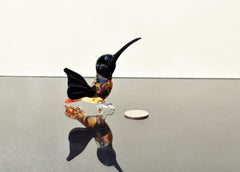 Beautiful colored Glass clear black hummingbird. Detailed figurine with character and personality.  Excellent addition to your collection.