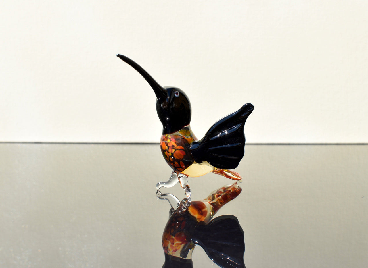 Beautiful colored Glass clear black hummingbird. Detailed figurine with character and personality.  Excellent addition to your collection.