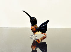 Beautiful colored Glass clear black hummingbird. Detailed figurine with character and personality.  Excellent addition to your collection.