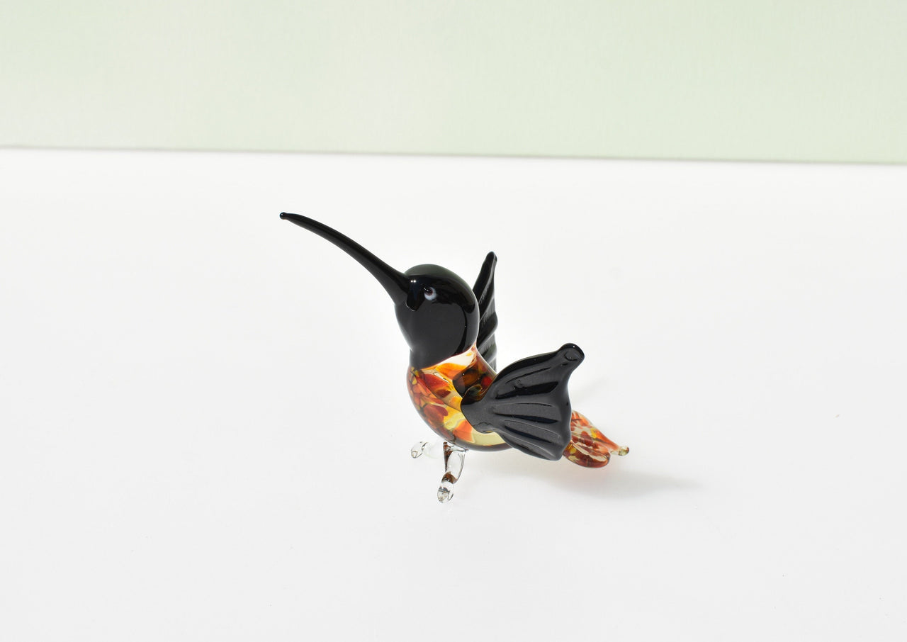 Beautiful colored Glass clear black hummingbird. Detailed figurine with character and personality.  Excellent addition to your collection.