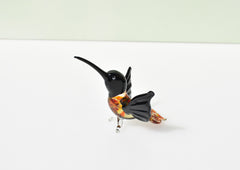 Beautiful colored Glass clear black hummingbird. Detailed figurine with character and personality.  Excellent addition to your collection.