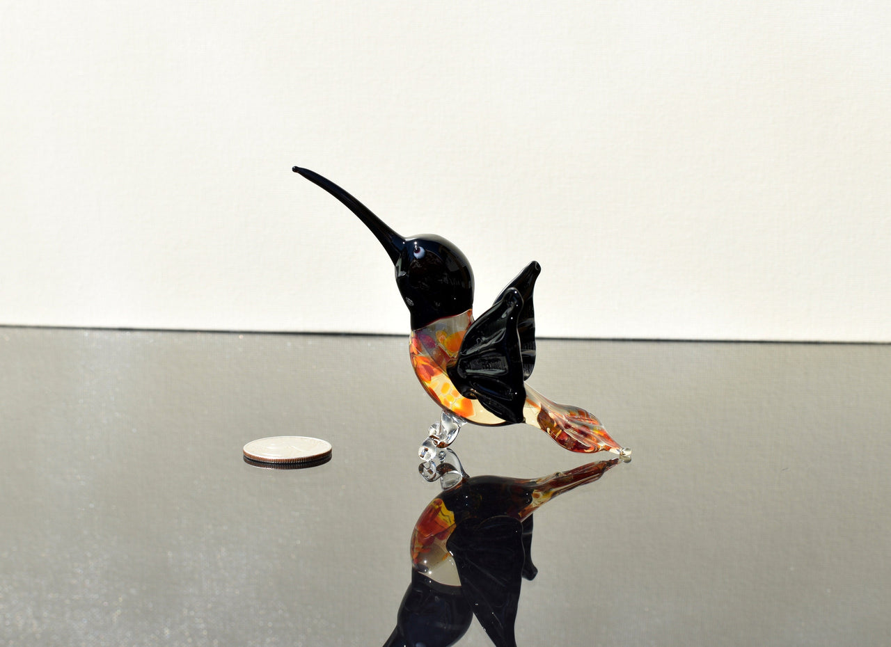 Beautiful colored Glass clear black hummingbird. Detailed figurine with character and personality.  Excellent addition to your collection.