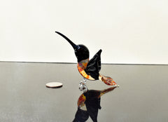 Beautiful colored Glass clear black hummingbird. Detailed figurine with character and personality.  Excellent addition to your collection.