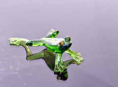 Jumping green glass  frog. Whimsical figurine with a lot of character and personality. Excellent addition to your glass collection.