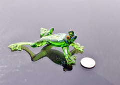 Jumping green glass  frog. Whimsical figurine with a lot of character and personality. Excellent addition to your glass collection.