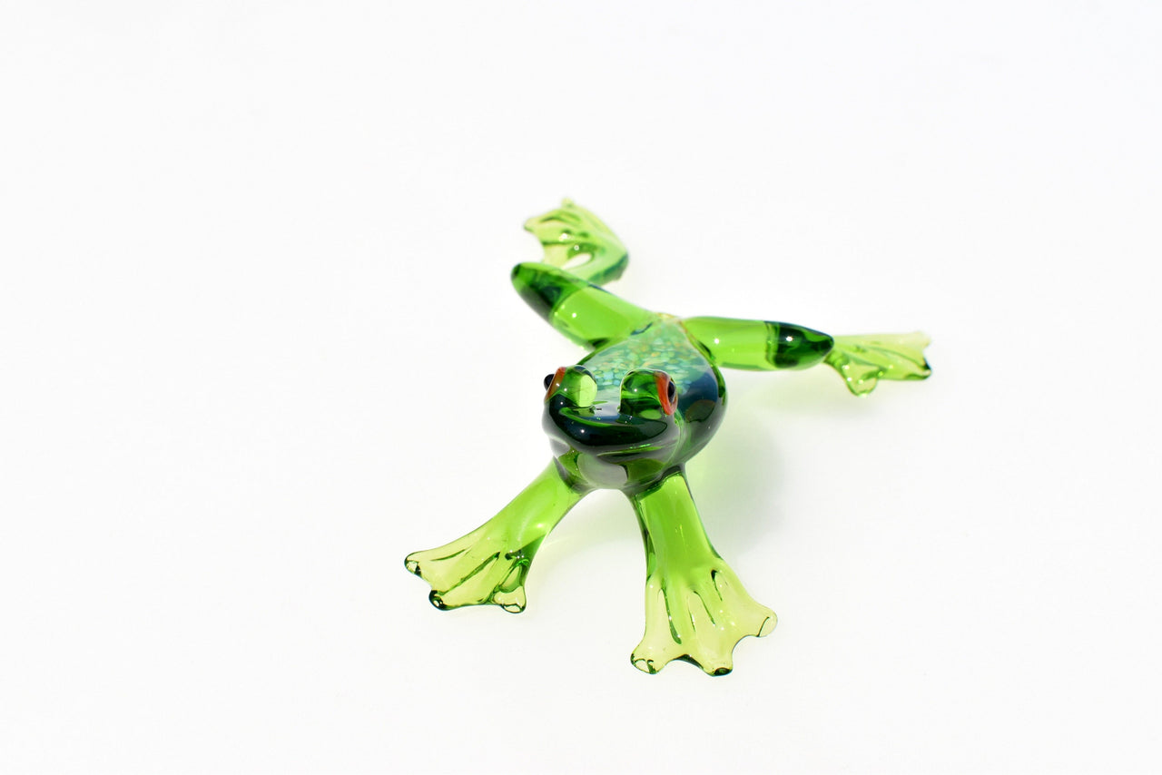 Jumping green glass  frog. Whimsical figurine with a lot of character and personality. Excellent addition to your glass collection.