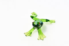 Jumping green glass  frog. Whimsical figurine with a lot of character and personality. Excellent addition to your glass collection.