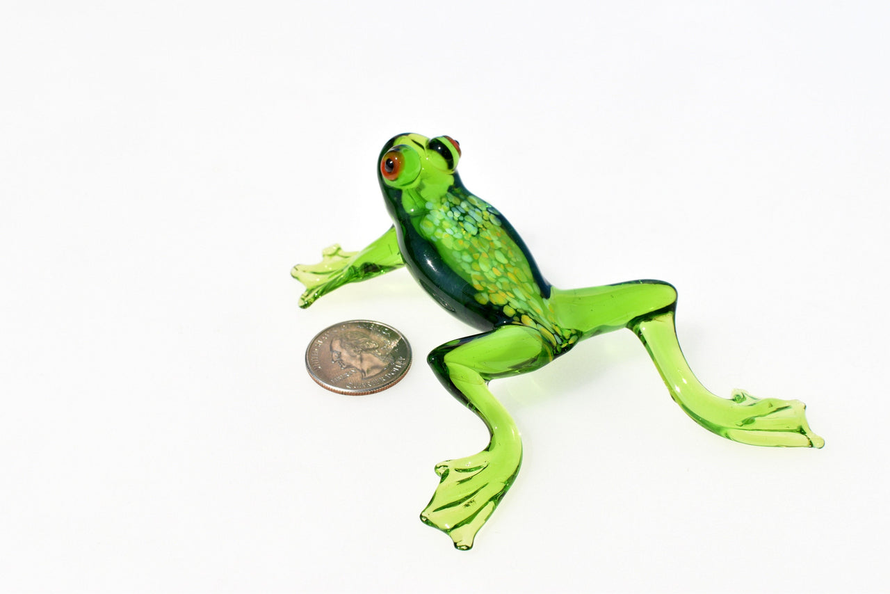 Jumping green glass  frog. Whimsical figurine with a lot of character and personality. Excellent addition to your glass collection.
