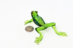 Jumping green glass  frog. Whimsical figurine with a lot of character and personality. Excellent addition to your glass collection.